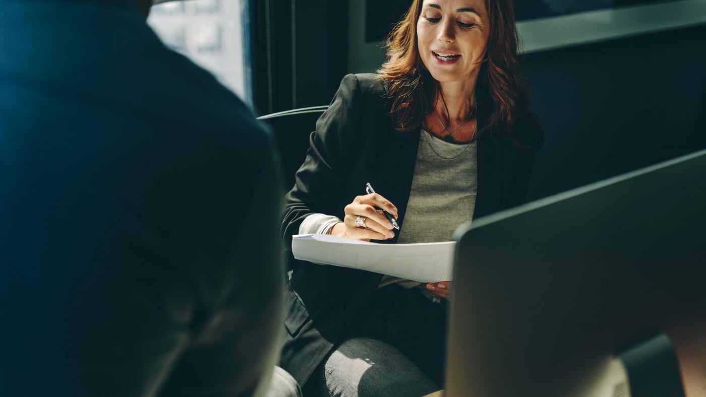 IT professional making notes about IT services