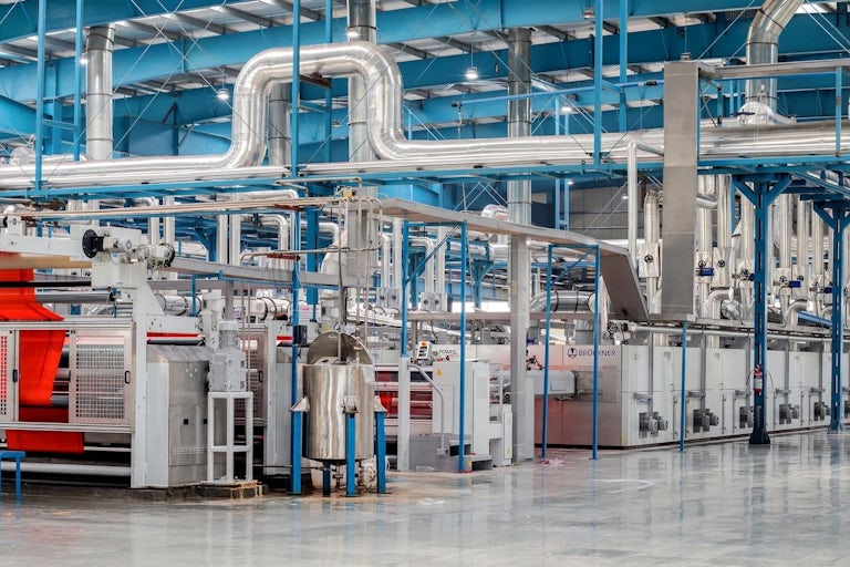 Manufacturing facility with modern machinery and ducting